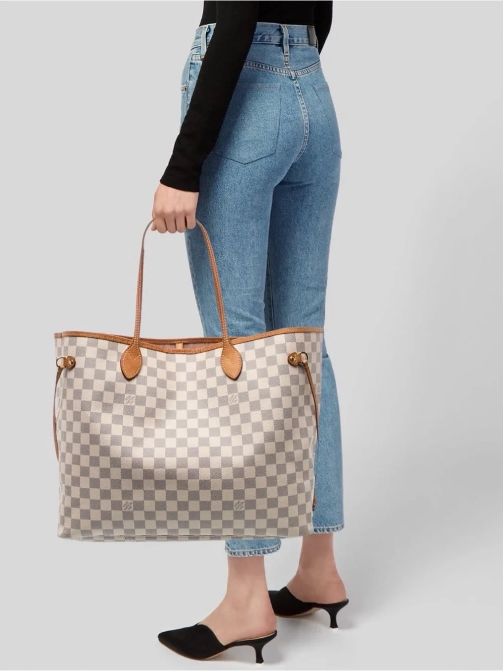 Louis Vuitton LV Neverfull MM tote is crafted from white and blue Damier Azur